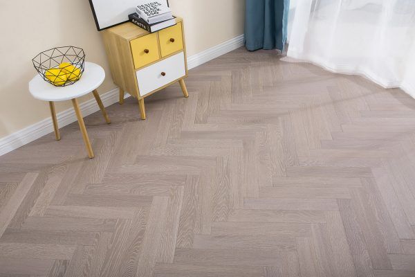 Minimalist grey oak flooring for architectural projects. Neutral tone, robust construction, and easy maintenance